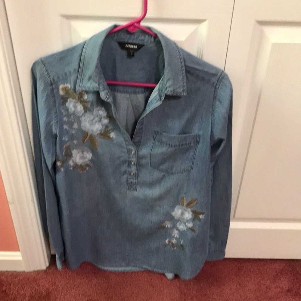 Express Denim blouse with embroidered flowers on the front.